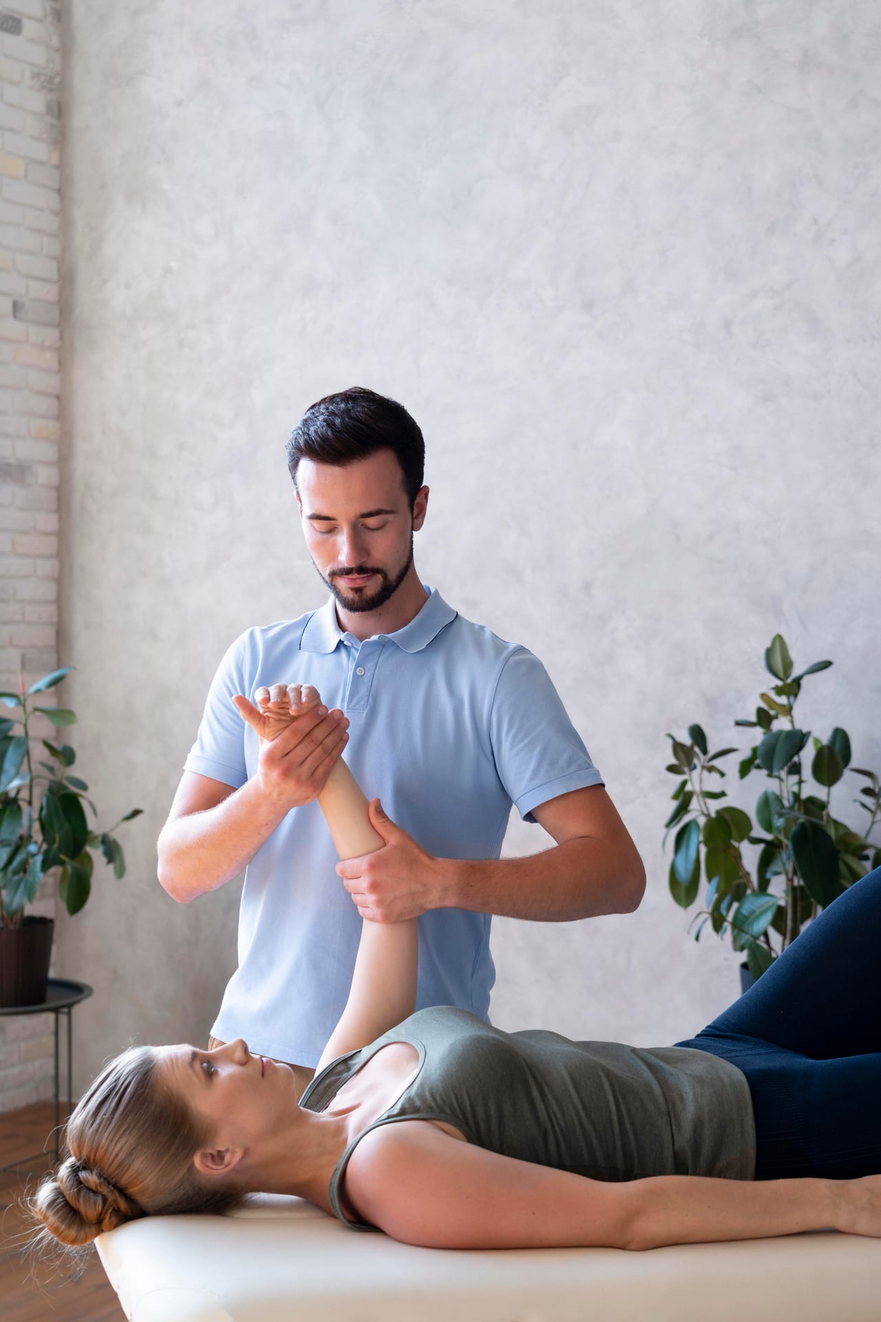 Physical therapist performing hands-on soft tissue treatment